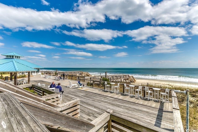 property view of water featuring a gazebo and a beach view