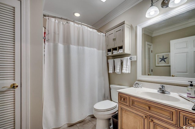 bathroom with crown molding, a closet, toilet, vanity, and tile patterned flooring