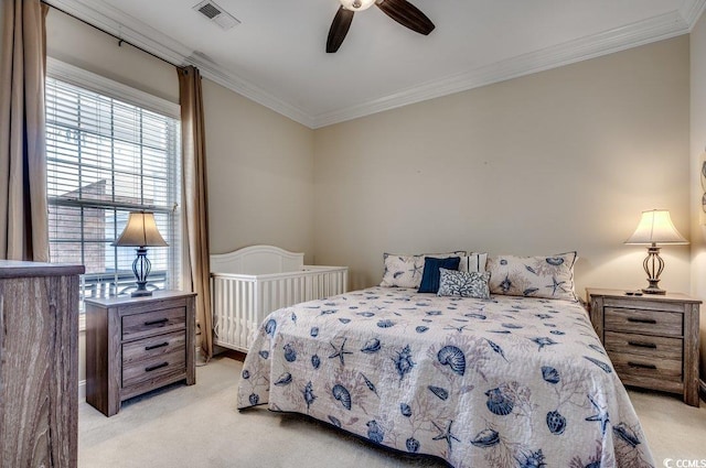 bedroom with light carpet, ceiling fan, ornamental molding, and visible vents