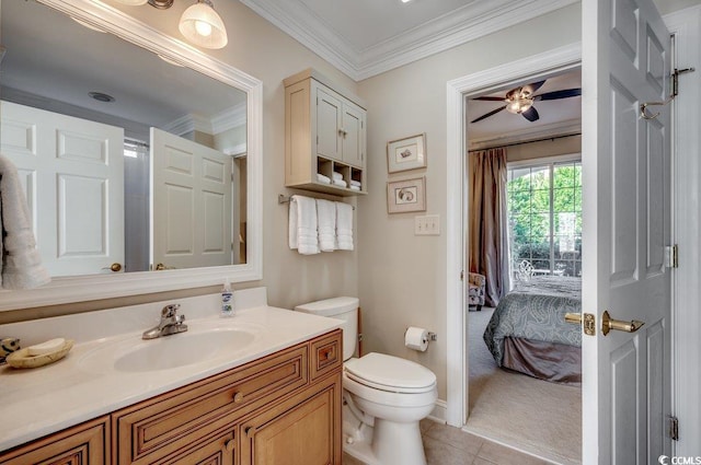 bathroom featuring toilet, ensuite bathroom, tile patterned flooring, crown molding, and vanity