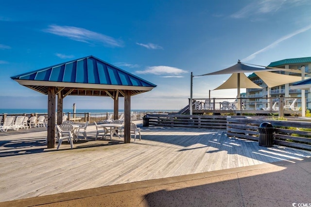 surrounding community featuring a gazebo and a water view