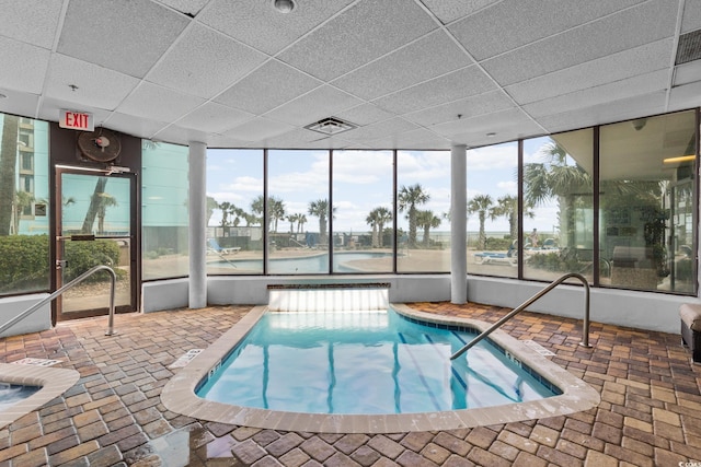 community pool with an indoor in ground hot tub