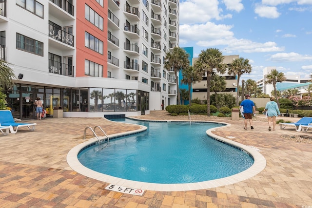 view of pool featuring a patio area