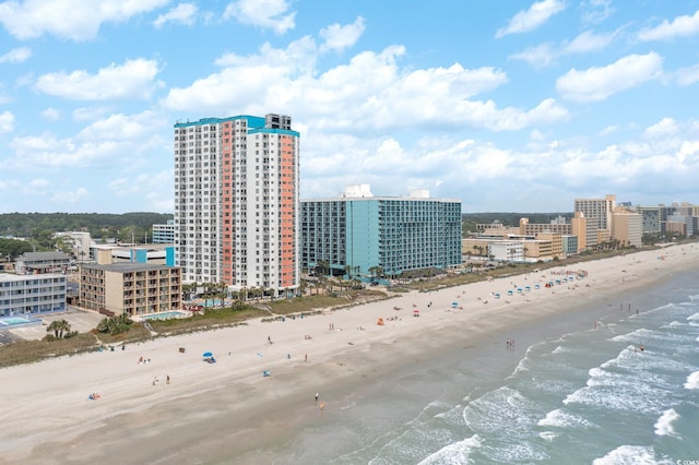 aerial view with a water view, a city view, and a view of the beach