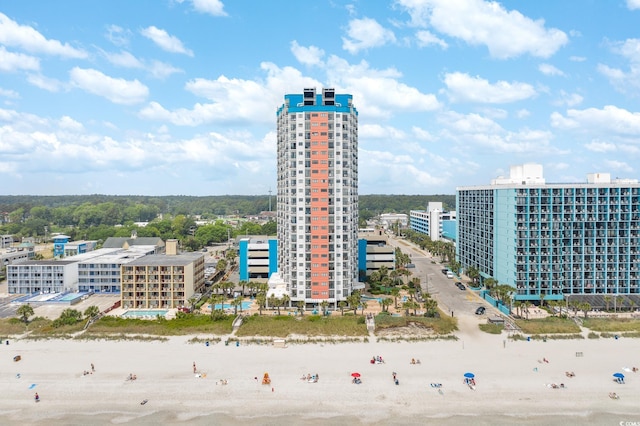 aerial view with a view of city, a water view, and a view of the beach