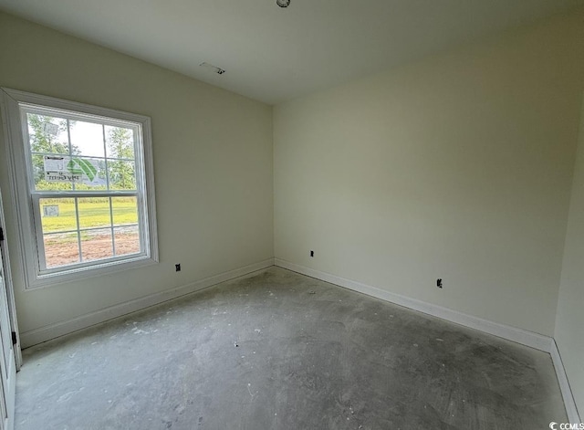 6049 Hodges Rd, Conway, SC 29527 - empty room featuring unfinished concrete floors and baseboards