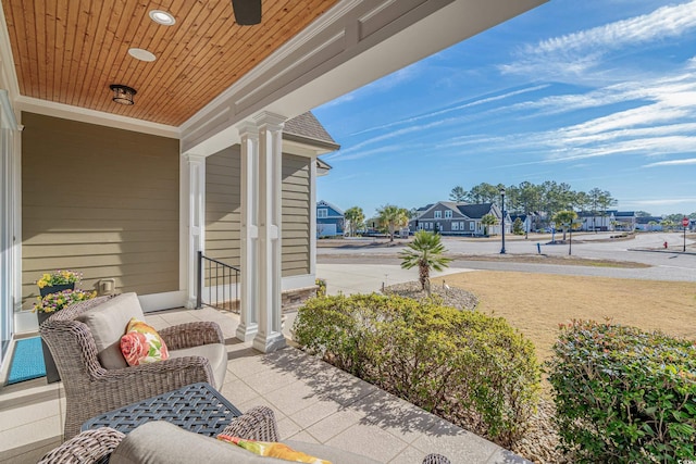 view of patio / terrace with covered porch and a residential view