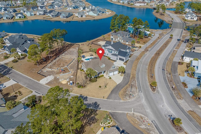 bird's eye view with a water view and a residential view