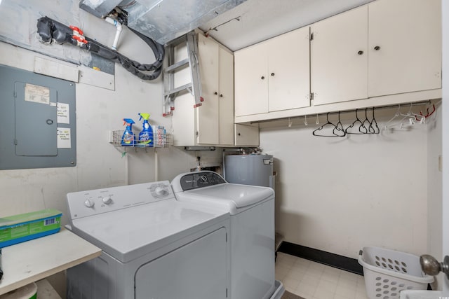 laundry room with washer and dryer, water heater, cabinet space, electric panel, and light floors