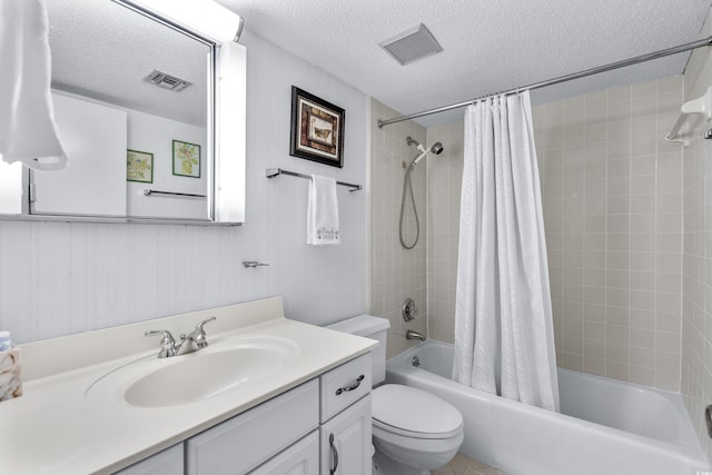 full bathroom with a textured ceiling, toilet, shower / bath combination with curtain, and visible vents