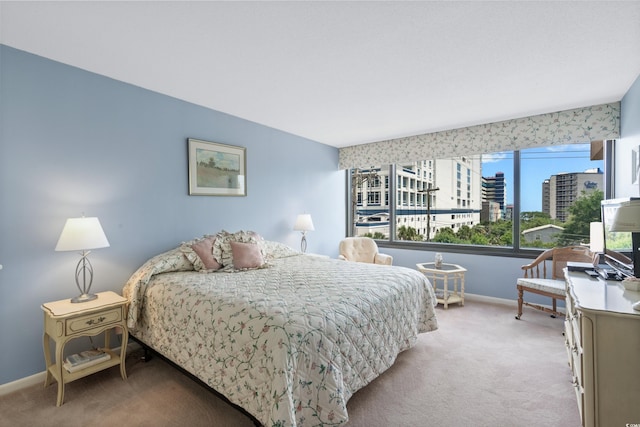 bedroom with carpet flooring and baseboards