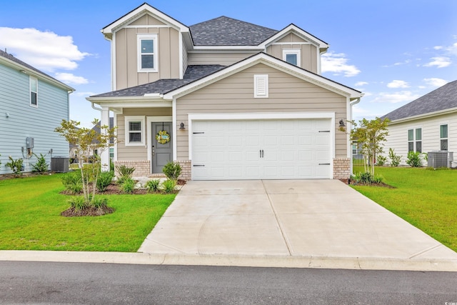 craftsman-style house featuring a shingled roof, brick siding, driveway, a front lawn, and board and batten siding