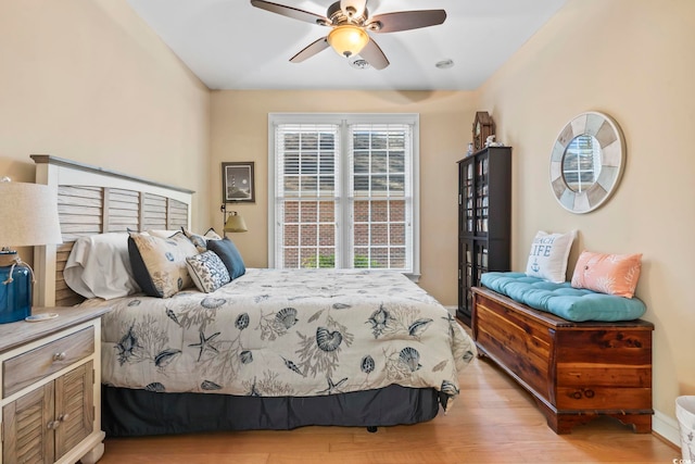 bedroom with ceiling fan and light wood finished floors