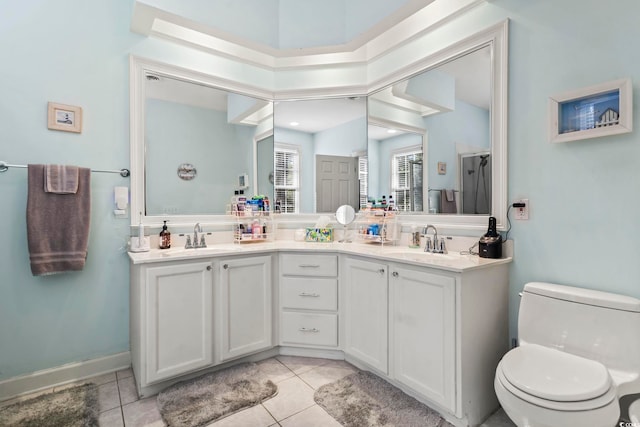 bathroom with tile patterned flooring, a sink, and toilet