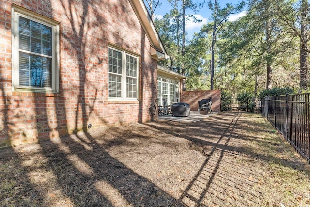 view of yard with a fenced backyard and a patio