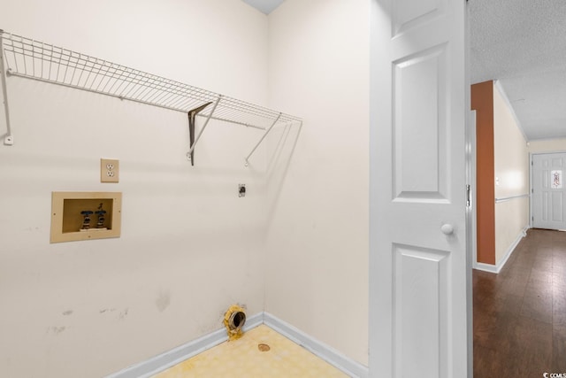 clothes washing area with laundry area, hookup for a washing machine, baseboards, and electric dryer hookup