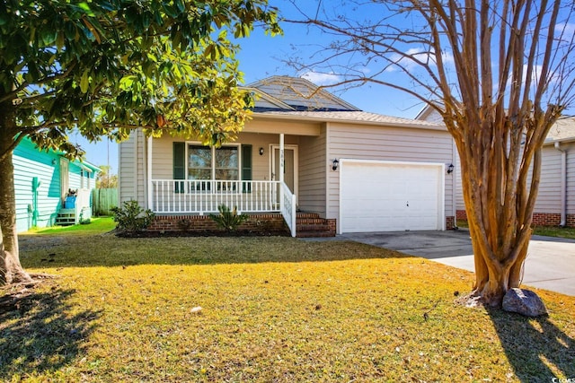 view of front of house featuring a porch, a front lawn, driveway, and an attached garage