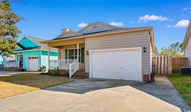 single story home with a porch, concrete driveway, central AC unit, a front yard, and fence