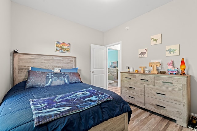 bedroom with light wood-style floors