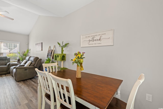 dining area with vaulted ceiling, ceiling fan, and wood finished floors