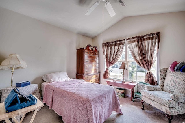 carpeted bedroom featuring lofted ceiling, ceiling fan, and visible vents