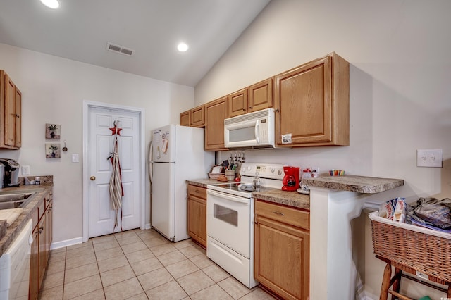 kitchen featuring white appliances, visible vents, light tile patterned flooring, vaulted ceiling, and recessed lighting