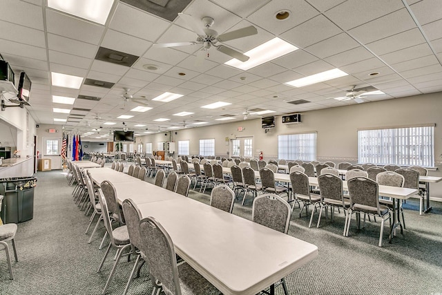 dining room with carpet floors, a paneled ceiling, plenty of natural light, and a ceiling fan