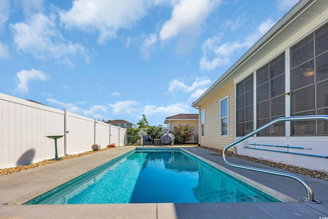 view of swimming pool featuring a fenced in pool and a fenced backyard