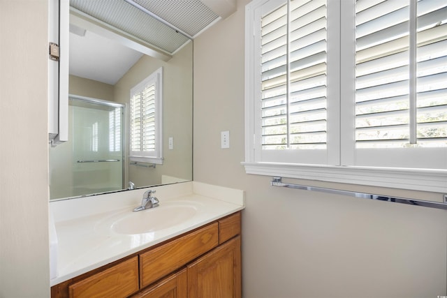 full bathroom with an enclosed shower and vanity