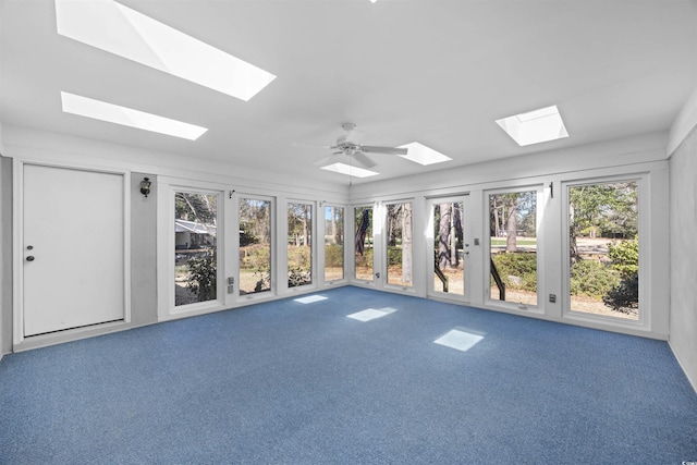 unfurnished sunroom with ceiling fan