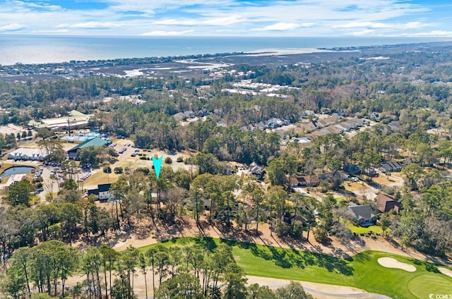 birds eye view of property featuring view of golf course and a water view