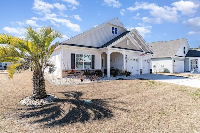 view of front facade with concrete driveway and an attached garage