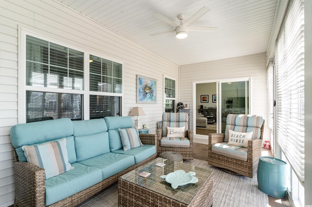 sunroom with a ceiling fan