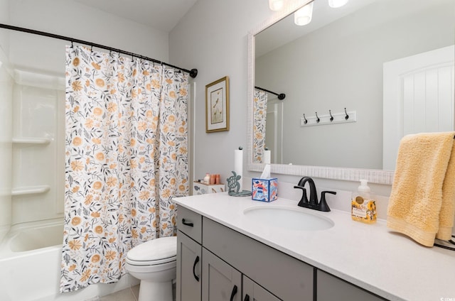 bathroom featuring toilet, tile patterned floors, shower / bath combo with shower curtain, and vanity