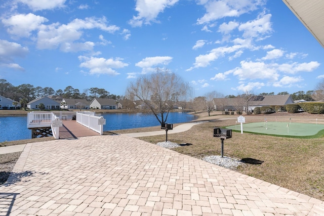 exterior space with a water view and a residential view