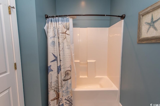 full bathroom with shower / bath combo