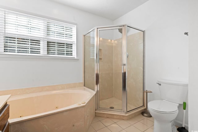 bathroom featuring toilet, a stall shower, vanity, tile patterned flooring, and a whirlpool tub