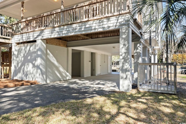 view of home's exterior with a carport and driveway