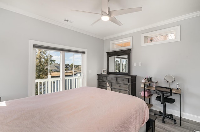 bedroom featuring baseboards, a ceiling fan, ornamental molding, wood finished floors, and access to outside