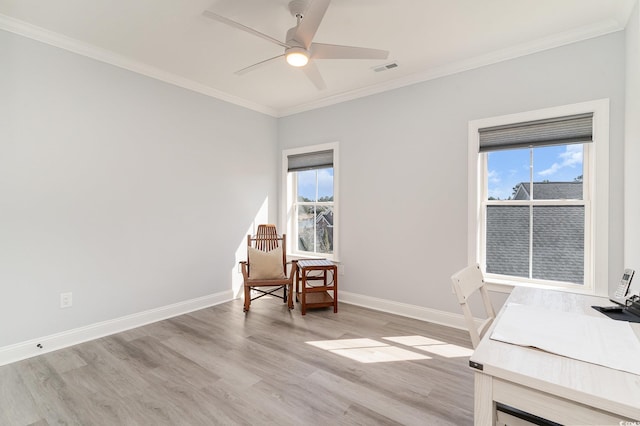 home office featuring baseboards, a wealth of natural light, and crown molding