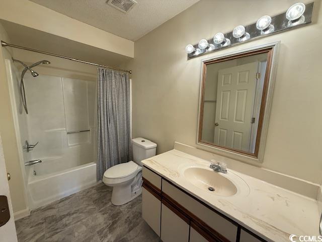 bathroom featuring a textured ceiling, toilet, vanity, visible vents, and shower / bath combination with curtain