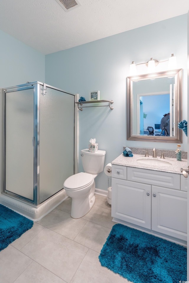 full bath featuring a stall shower, tile patterned flooring, and vanity