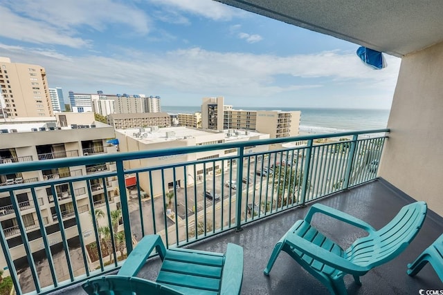 balcony featuring a view of city and a water view