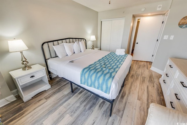 205 74th Ave N Unit 702, Myrtle Beach, SC 29572 - bedroom with a closet and light wood-style flooring