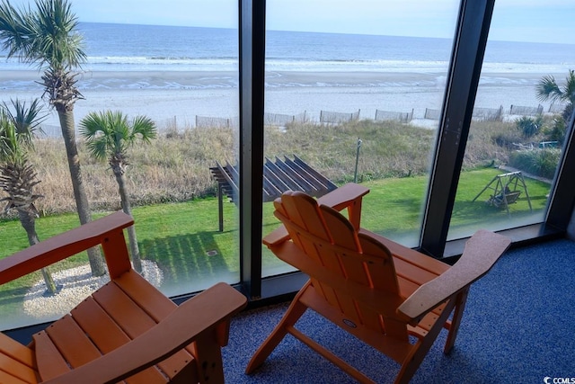 exterior space featuring a beach view and a water view