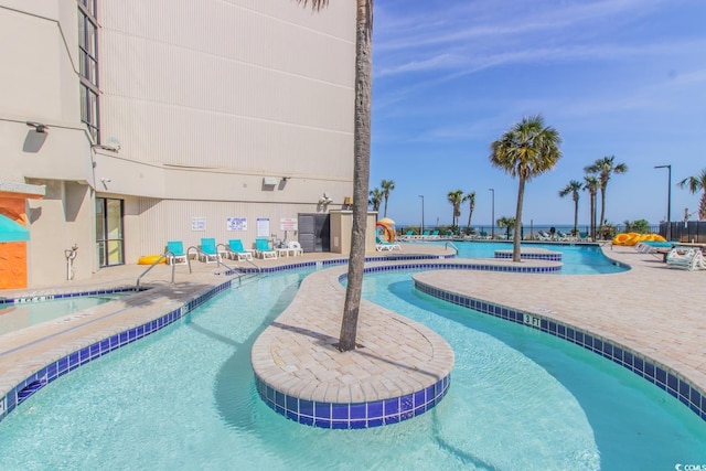 community pool featuring a patio area