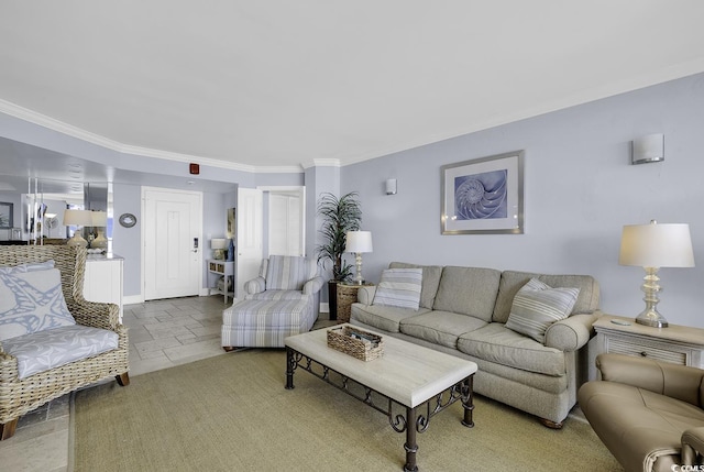 living area featuring baseboards, stone tile flooring, and crown molding