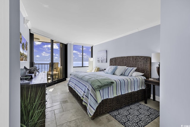 bedroom featuring stone tile floors, a water view, access to exterior, a wall of windows, and crown molding