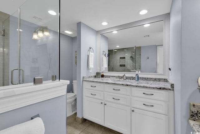 full bath featuring toilet, recessed lighting, visible vents, vanity, and a shower stall