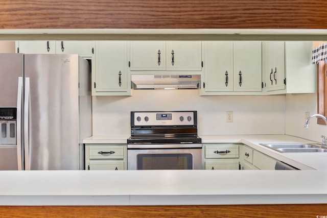 kitchen with a sink, under cabinet range hood, stainless steel appliances, and light countertops